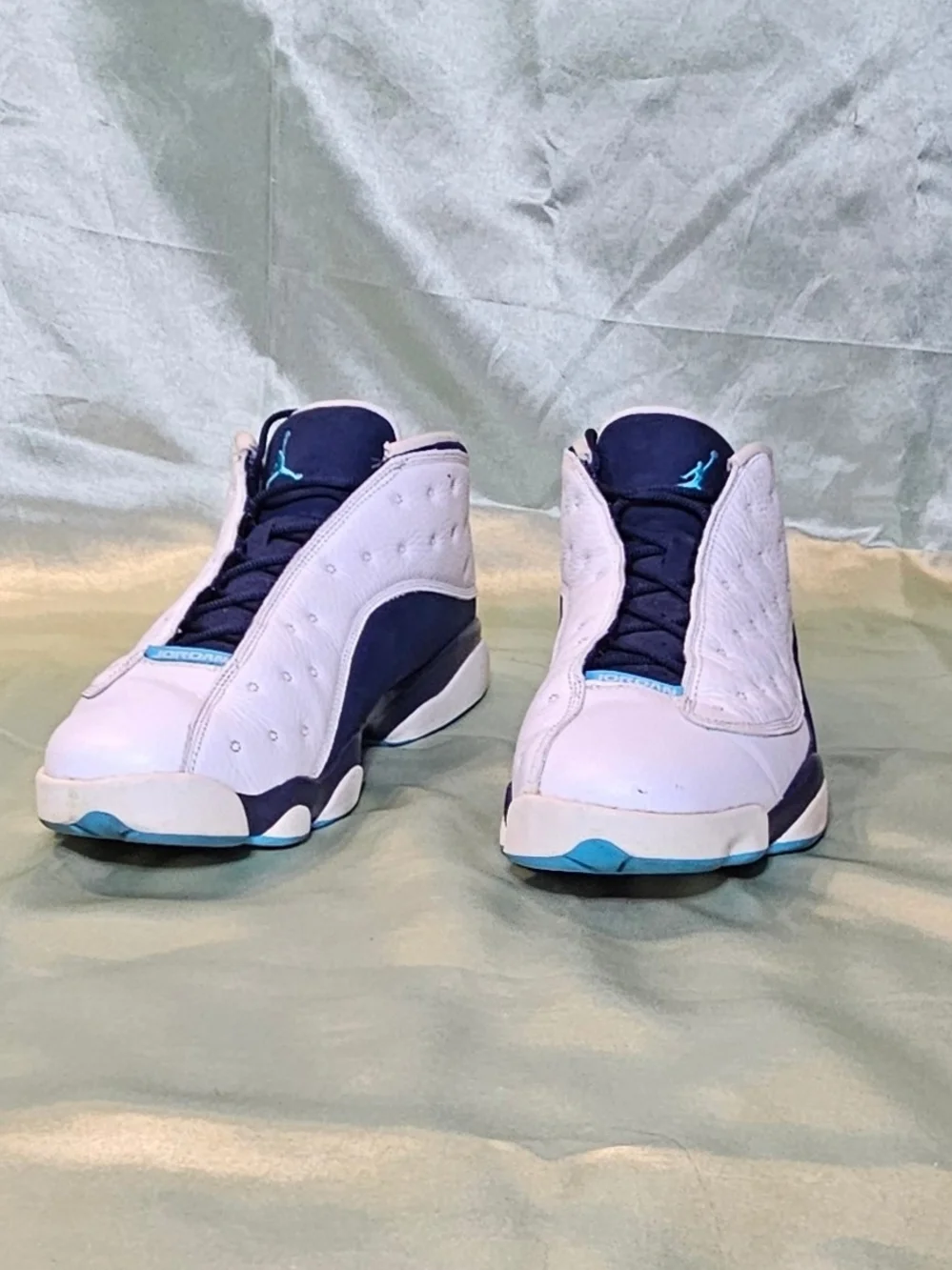 Air Jordan Retro Basketball Sneakers in White and Navy with Teal Accents